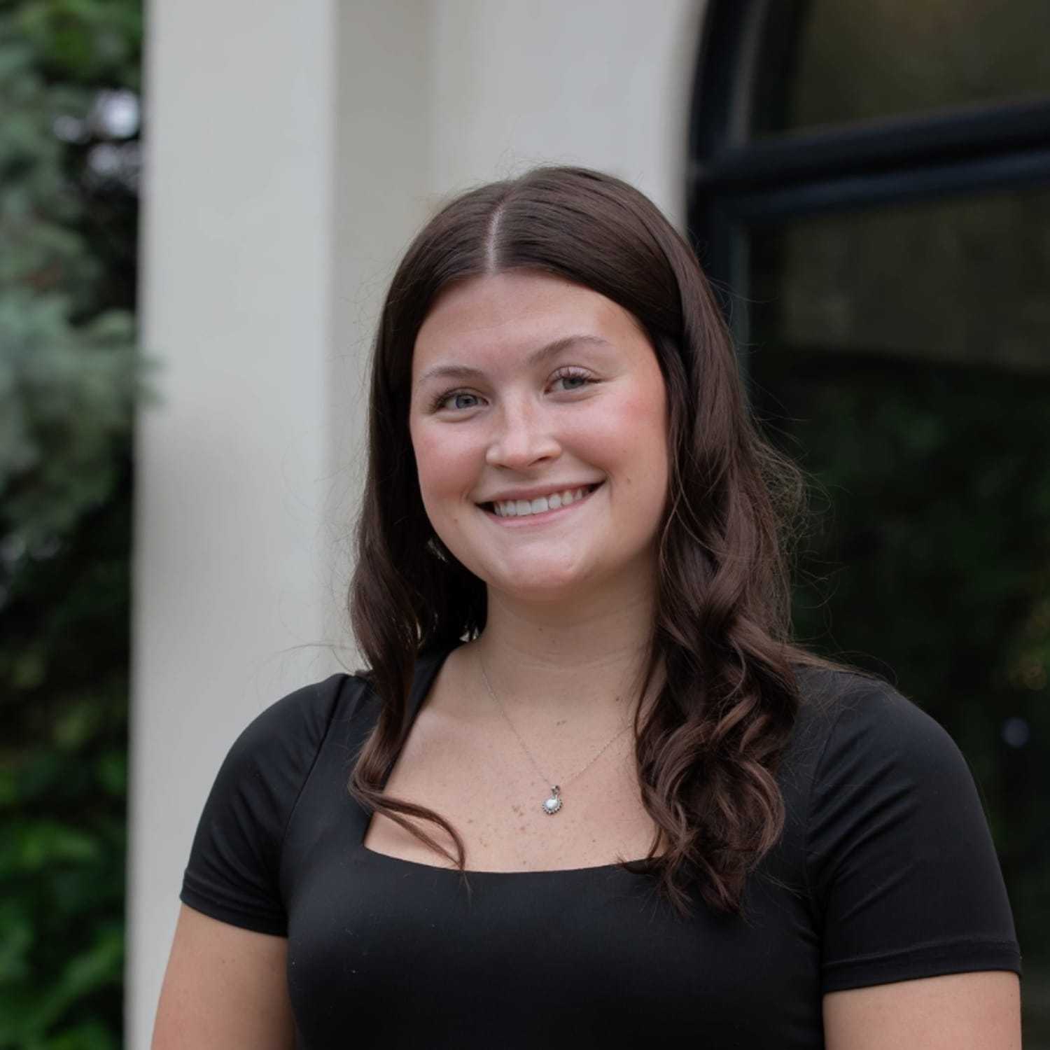 Portrait of Taylor M., a professional stylist at First Impressions Salon & Spa, showcasing their expertise and style.