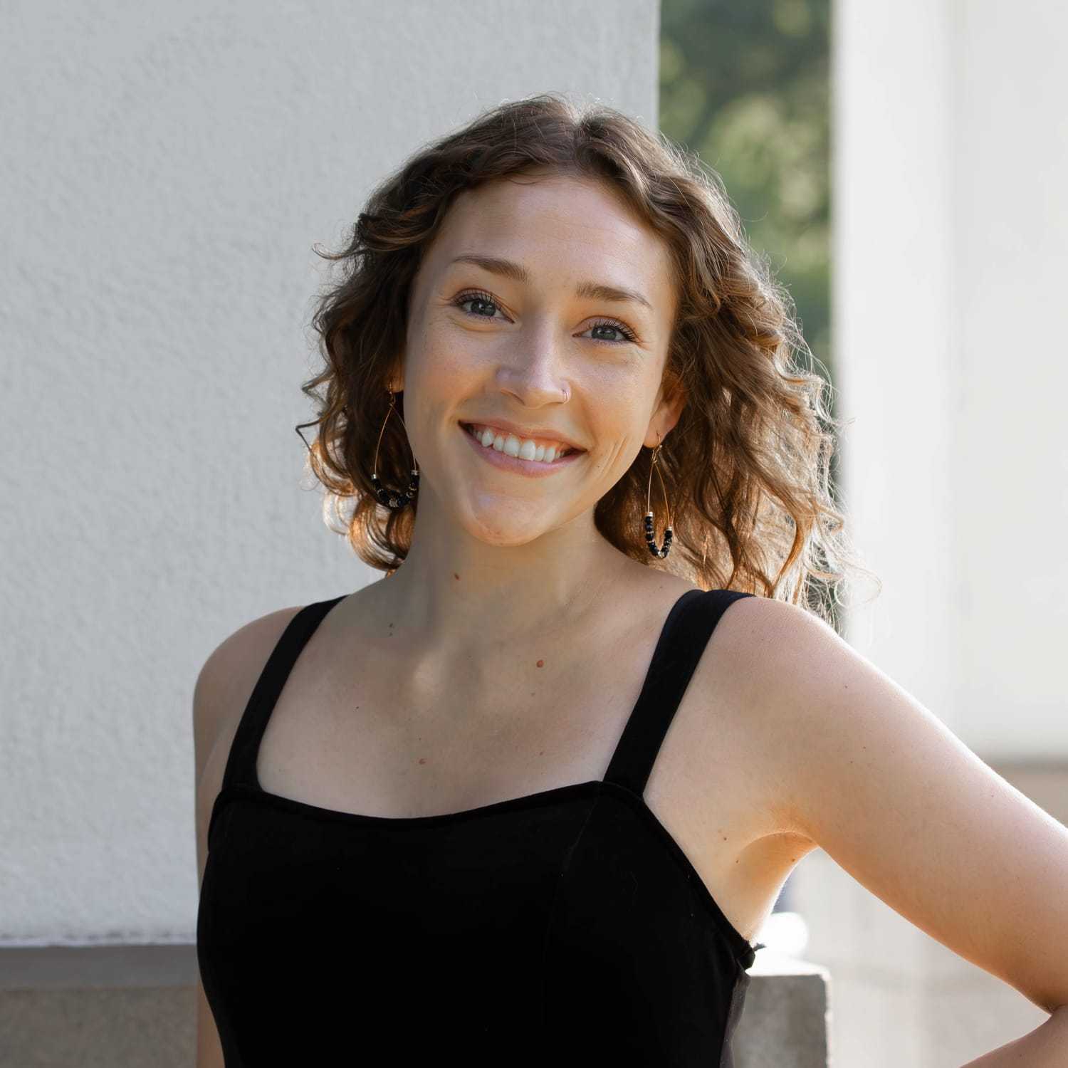 Portrait of Olivia J., a professional stylist at First Impressions Salon & Spa, showcasing their expertise and style.