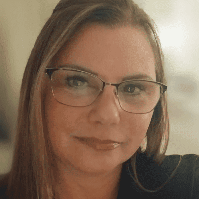 Portrait of Stacy K., a professional stylist at First Impressions Salon & Spa, showcasing their expertise and style.