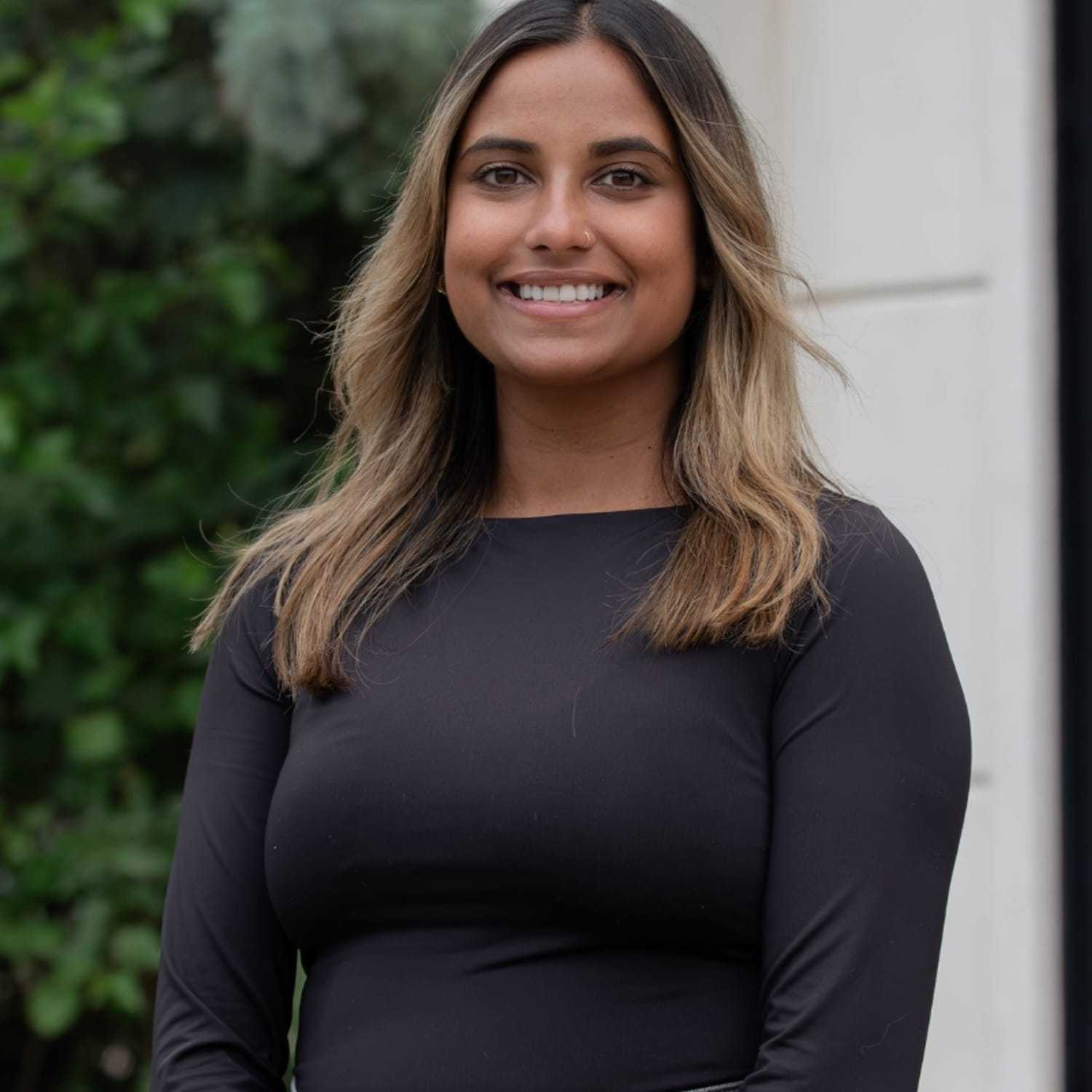 Portrait of Paula M., a professional stylist at First Impressions Salon & Spa, showcasing their expertise and style.