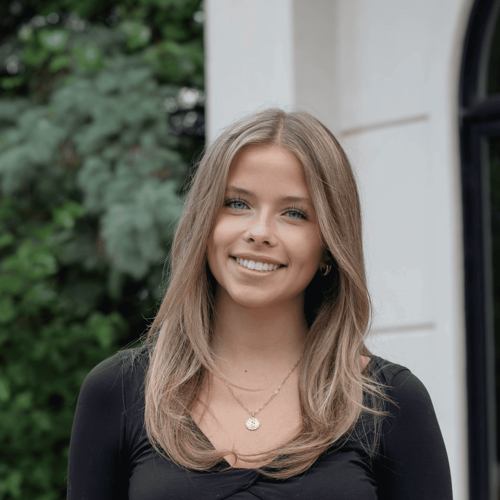 Portrait of Tessa, a professional stylist at First Impressions Salon & Spa, showcasing their expertise and style.