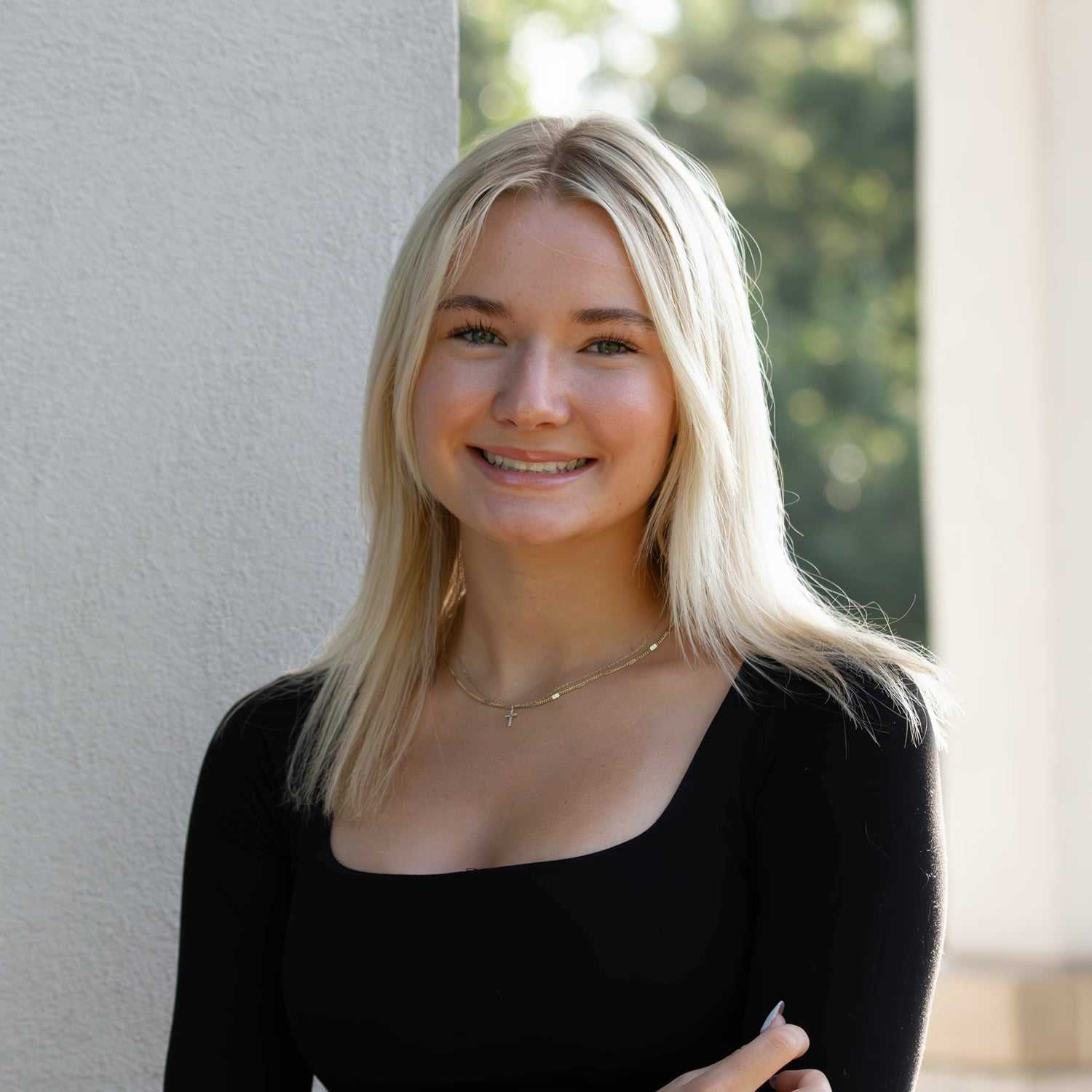 Portrait of Emma V., a professional stylist at First Impressions Salon & Spa, showcasing their expertise and style.