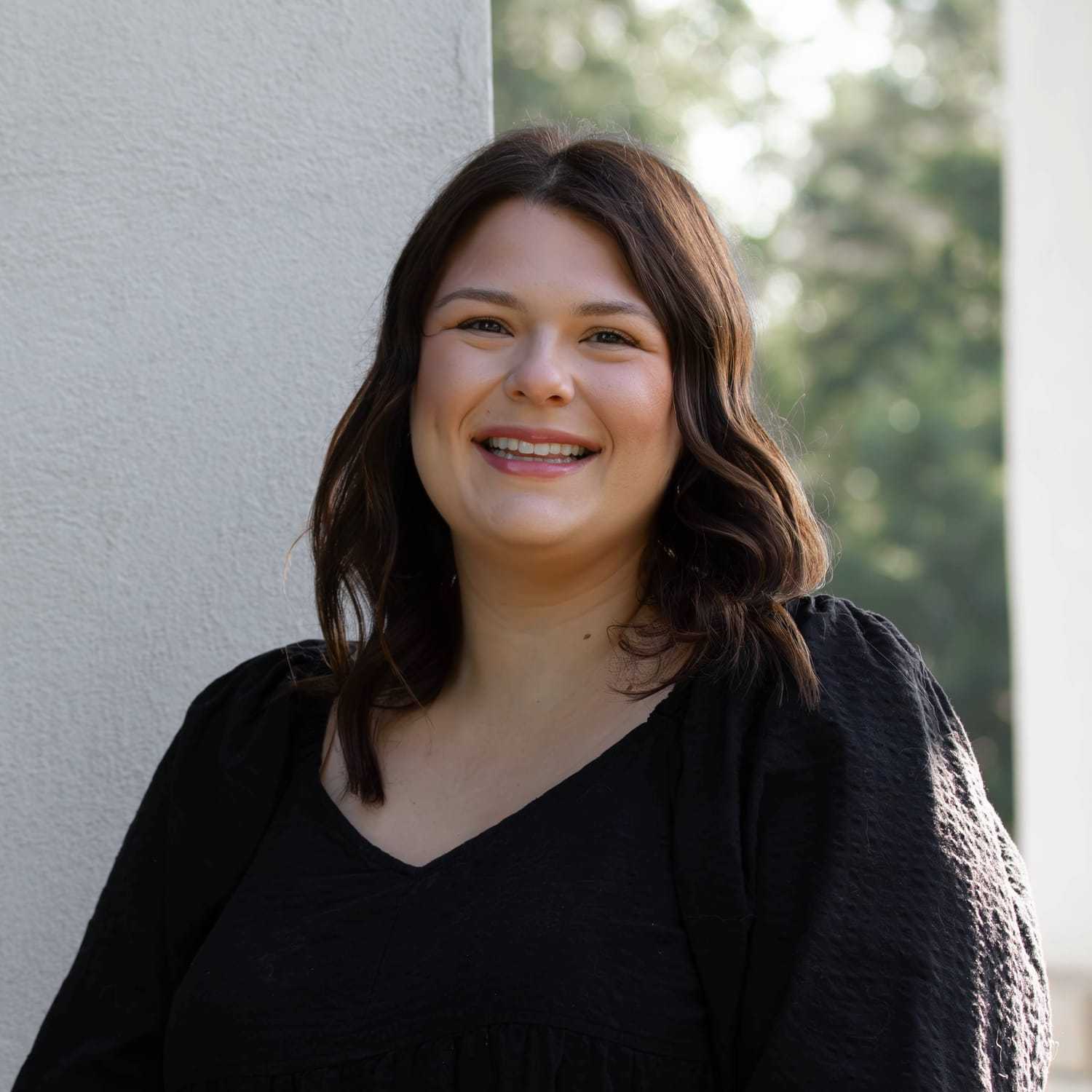 Portrait of Deanne O., a professional stylist at First Impressions Salon & Spa, showcasing their expertise and style.