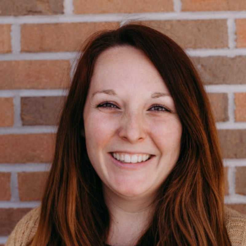 Portrait of Kayli P., a professional stylist at First Impressions Salon & Spa, showcasing their expertise and style.
