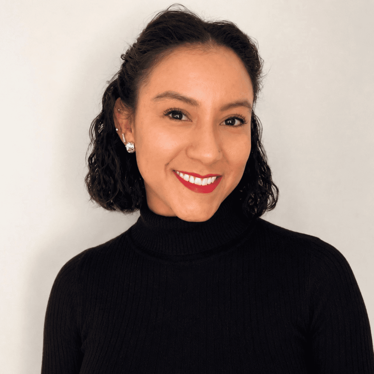 Portrait of Elizabeth T, a professional stylist at First Impressions Salon & Spa, showcasing their expertise and style.