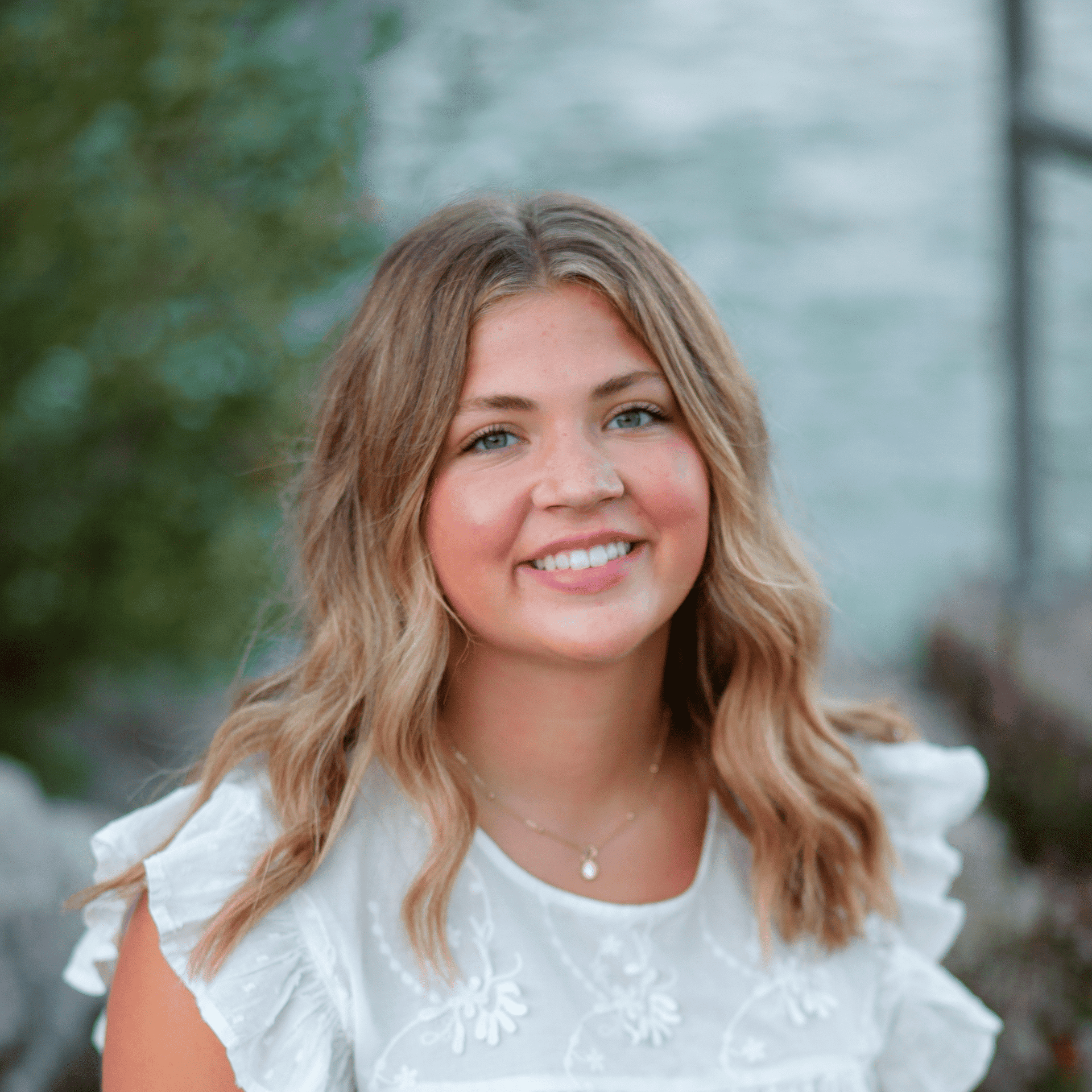 Portrait of Regan D, a professional stylist at First Impressions Salon & Spa, showcasing their expertise and style.