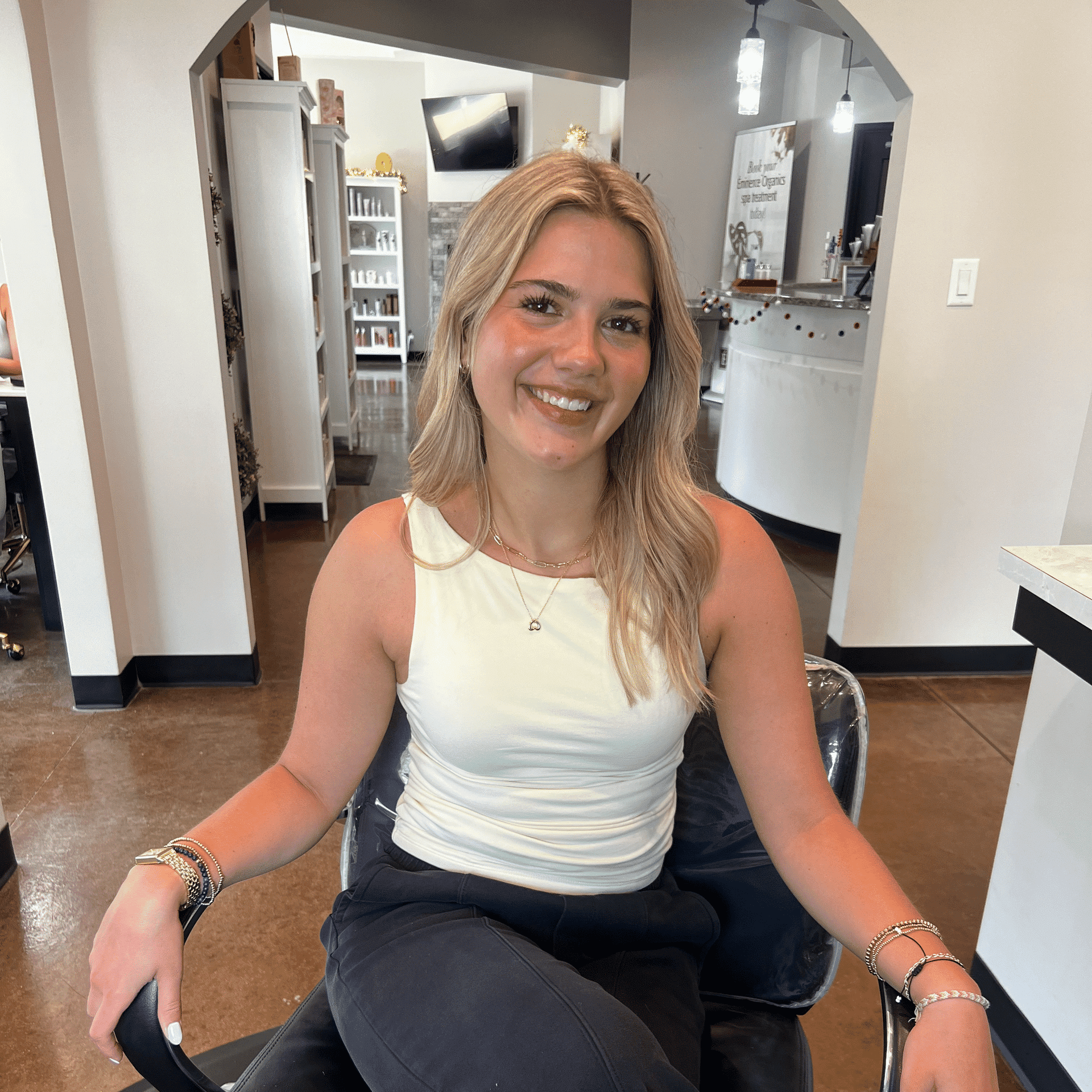 Portrait of Ashlyn B, a professional stylist at First Impressions Salon & Spa, showcasing their expertise and style.