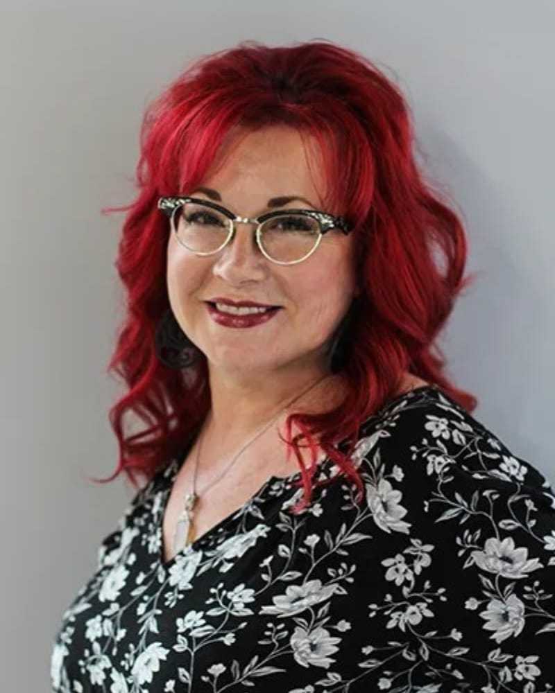 Portrait of Lisa B., a professional stylist at First Impressions Salon & Spa, showcasing their expertise and style.