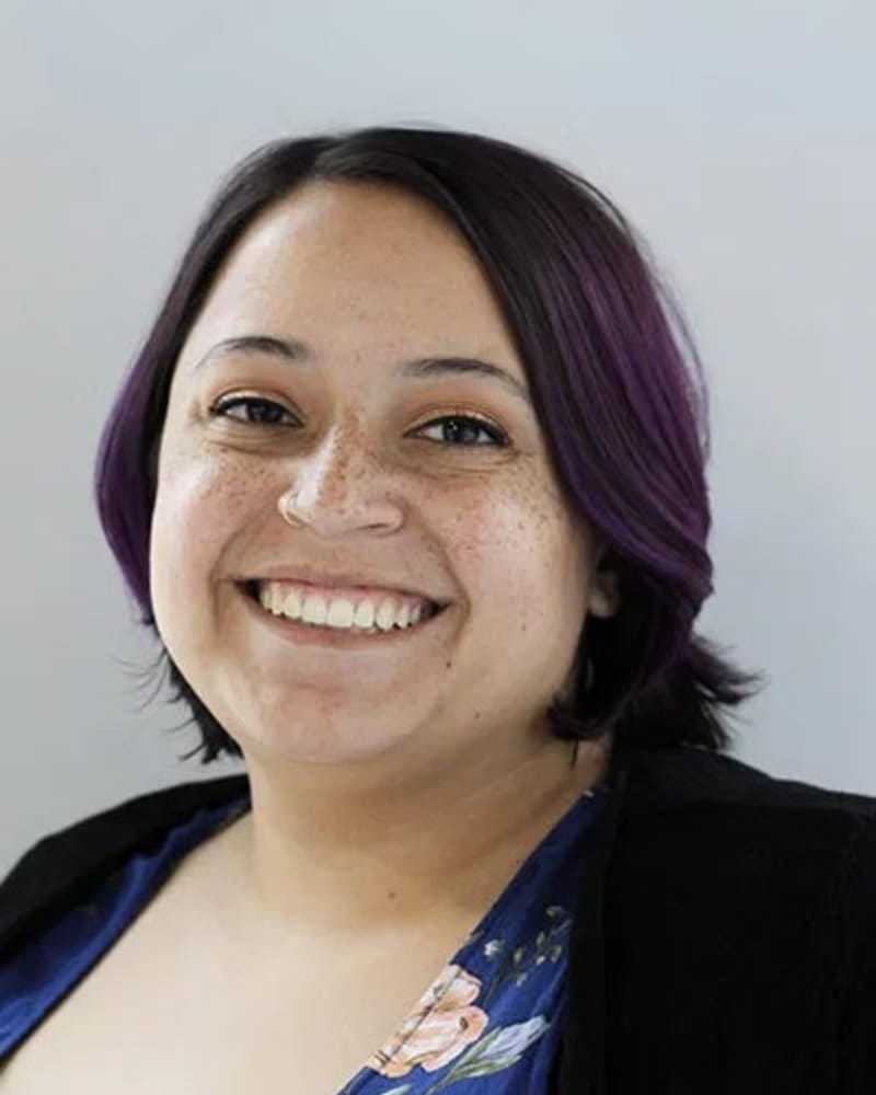 Portrait of Katie B., a professional stylist at First Impressions Salon & Spa, showcasing their expertise and style.