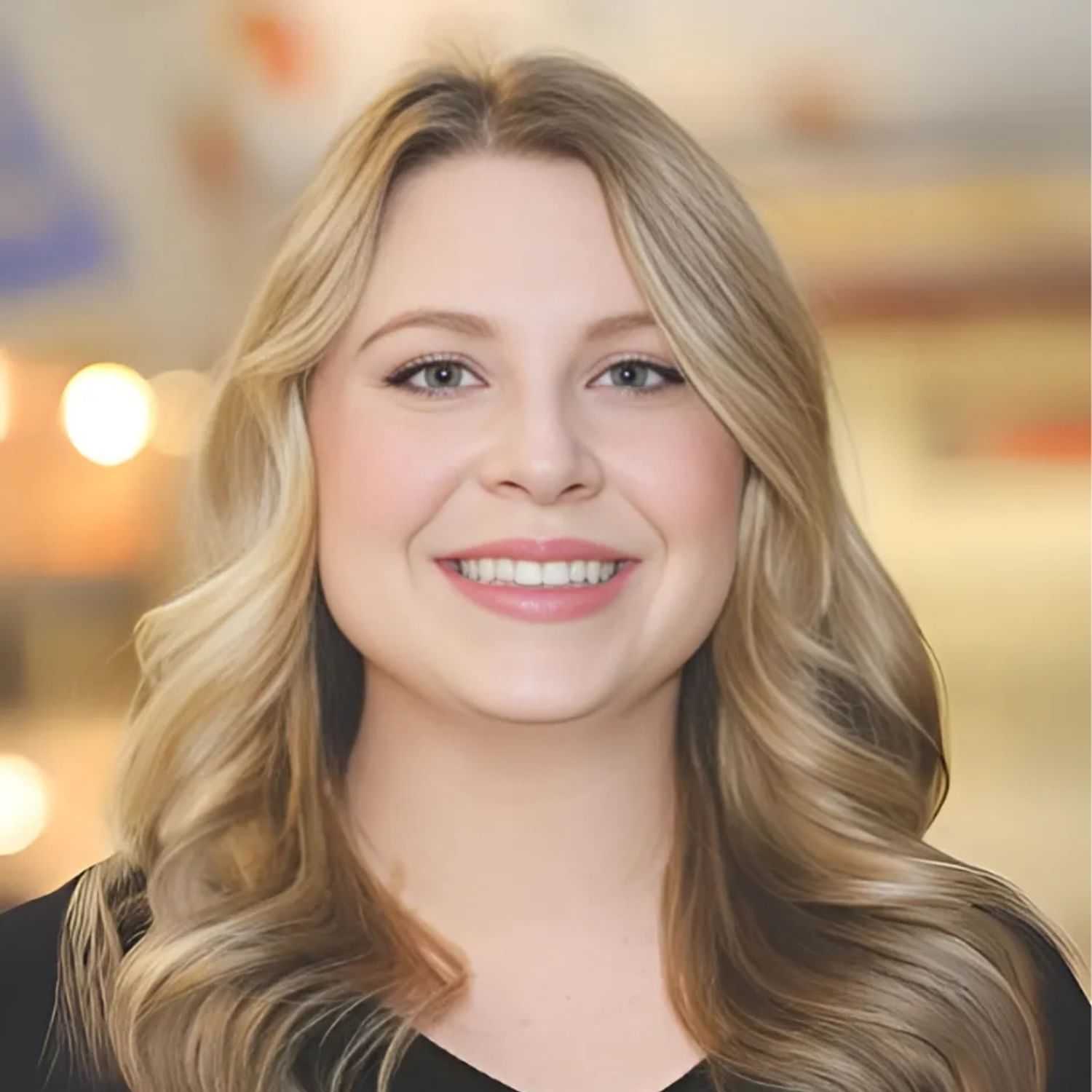 Portrait of Elizabeth F., a professional stylist at First Impressions Salon & Spa, showcasing their expertise and style.