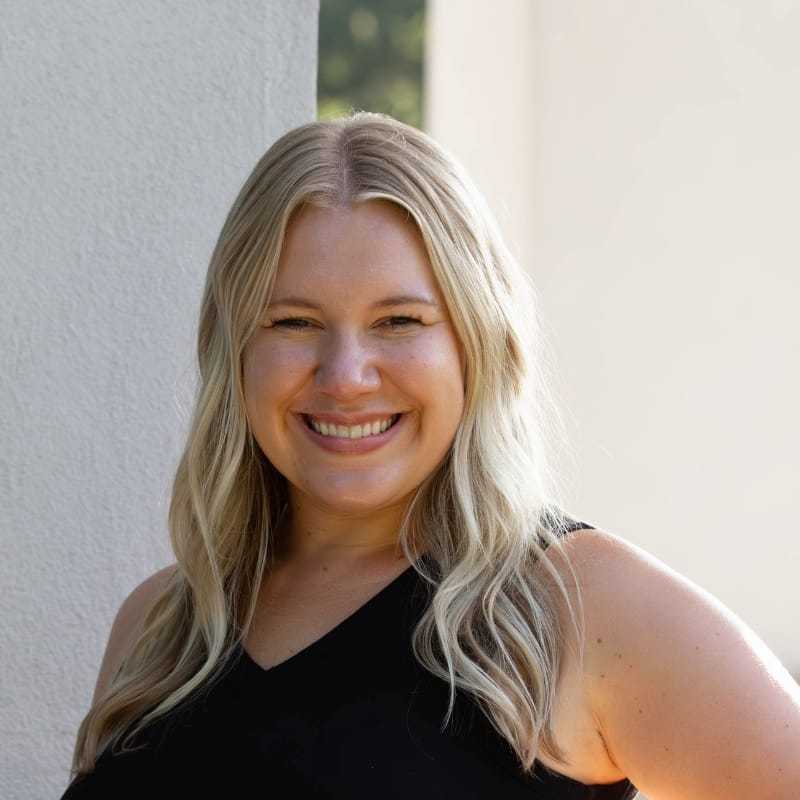 Portrait of Lesley L., a professional stylist at First Impressions Salon & Spa, showcasing their expertise and style.