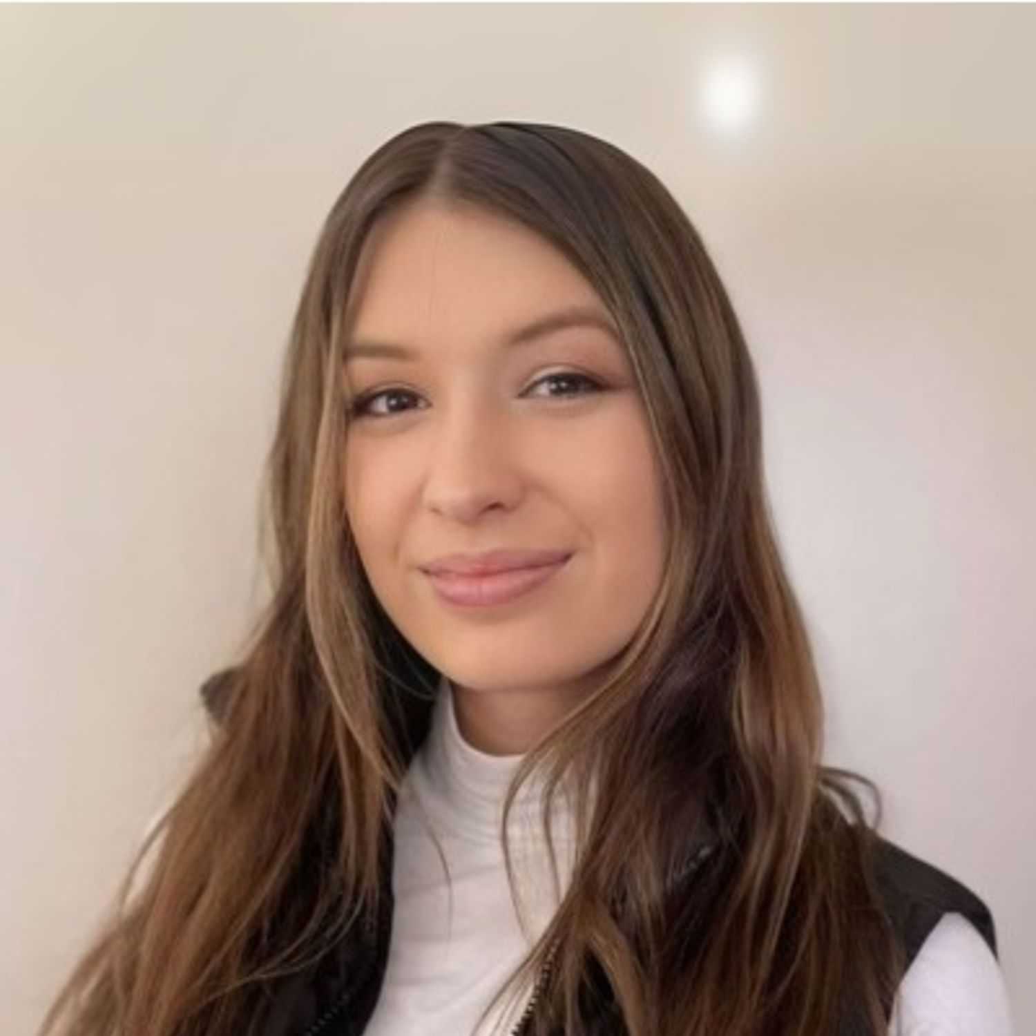 Portrait of Grace B., a professional stylist at First Impressions Salon & Spa, showcasing their expertise and style.