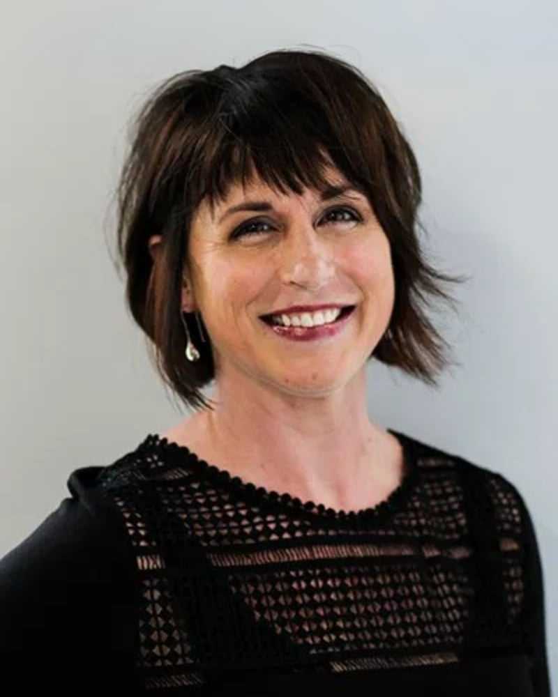 Portrait of Wincie N., a professional stylist at First Impressions Salon & Spa, showcasing their expertise and style.