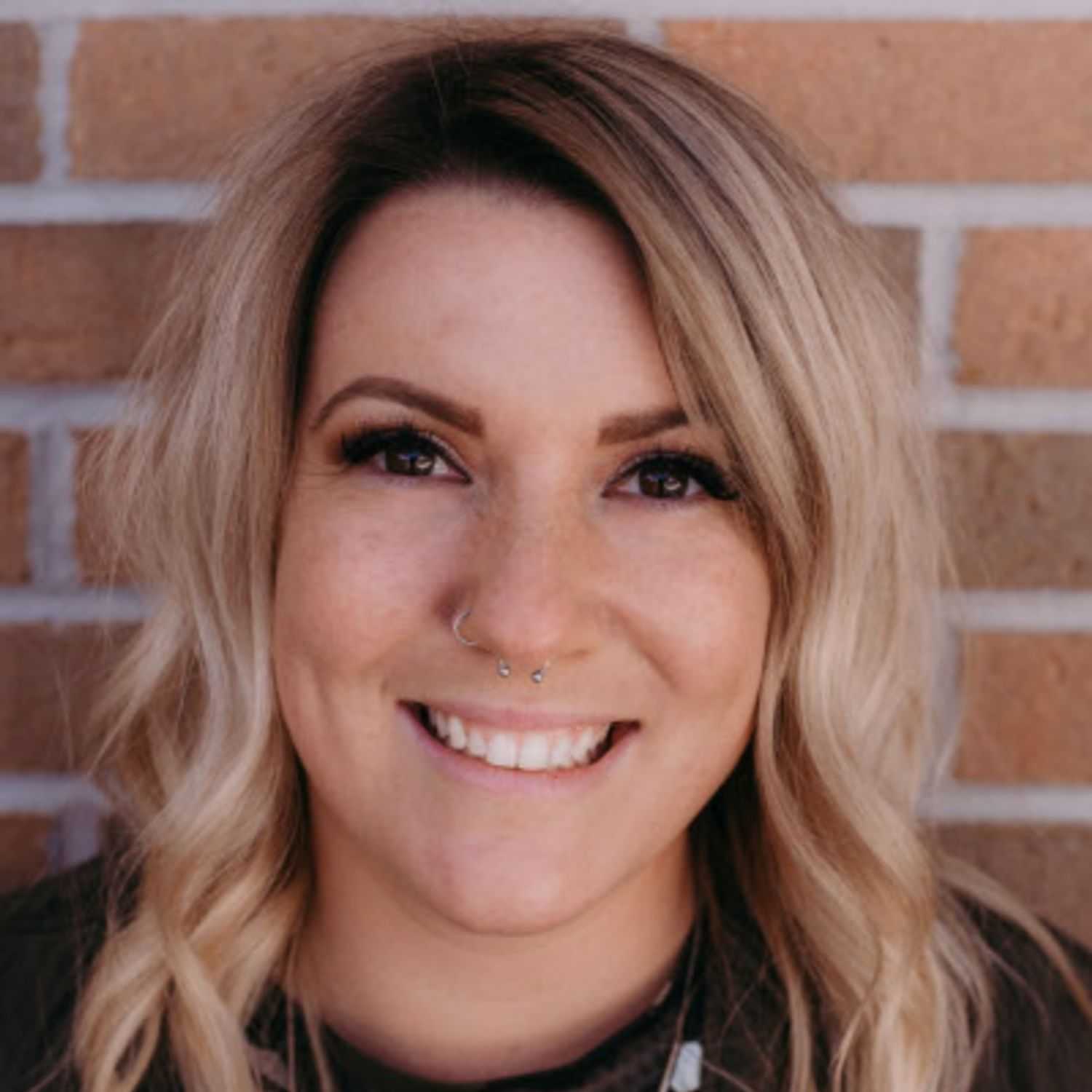 Portrait of Sara S., a professional stylist at First Impressions Salon & Spa, showcasing their expertise and style.