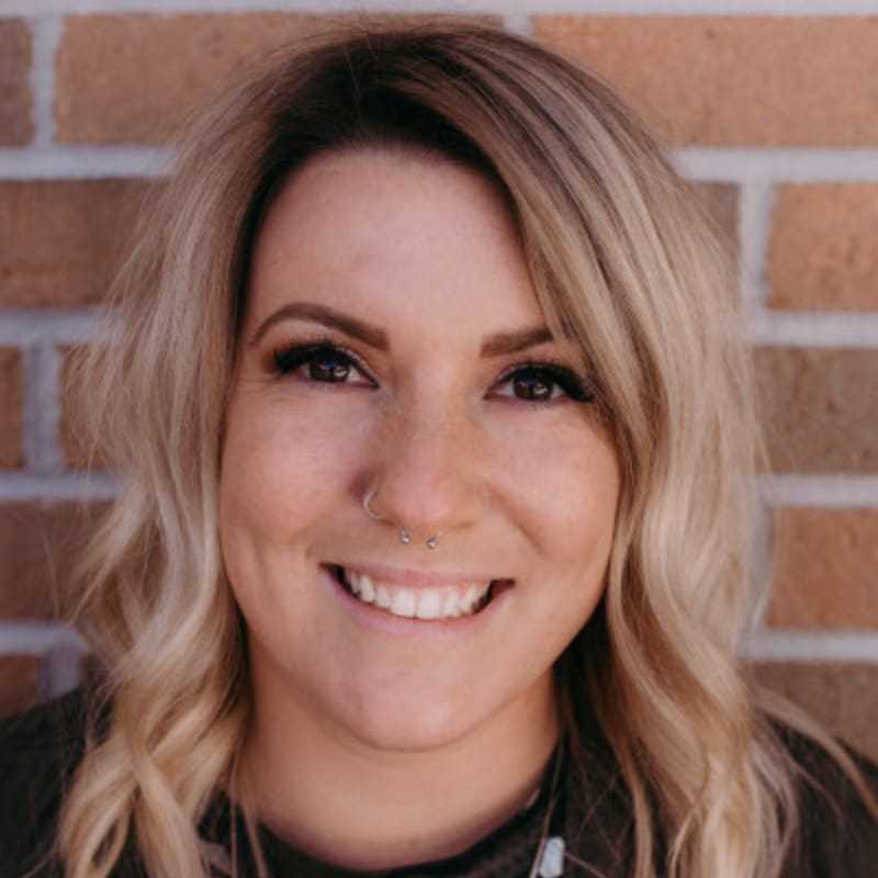 Portrait of Sara S., a professional stylist at First Impressions Salon & Spa, showcasing their expertise and style.