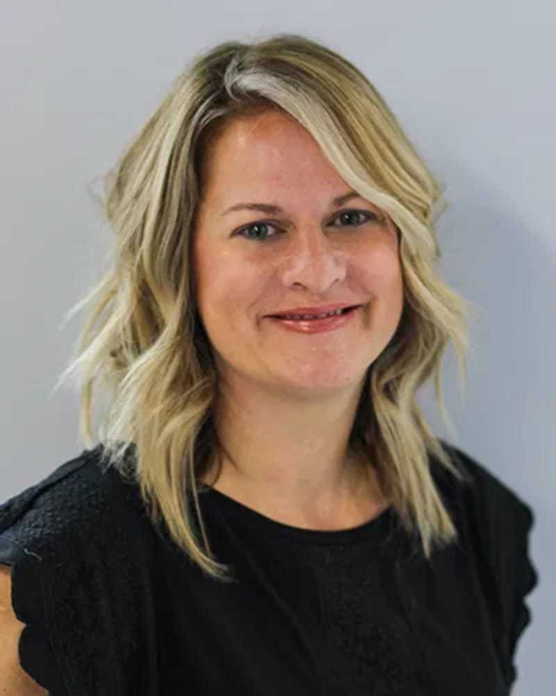 Portrait of Lori Yant, a professional stylist at First Impressions Salon & Spa, showcasing their expertise and style.