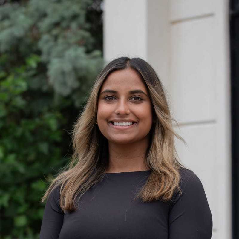 Portrait of Paula M., a professional stylist at First Impressions Salon & Spa, showcasing their expertise and style.