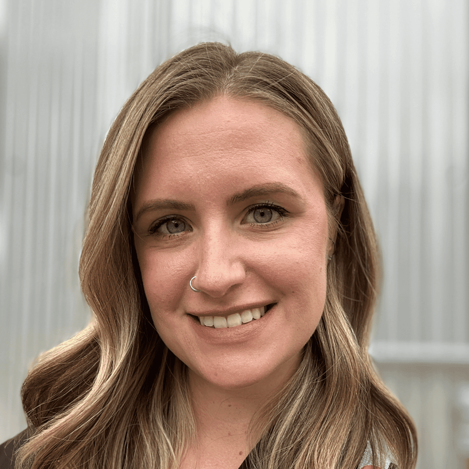 Portrait of Jessica, a professional stylist at First Impressions Salon & Spa, showcasing their expertise and style.