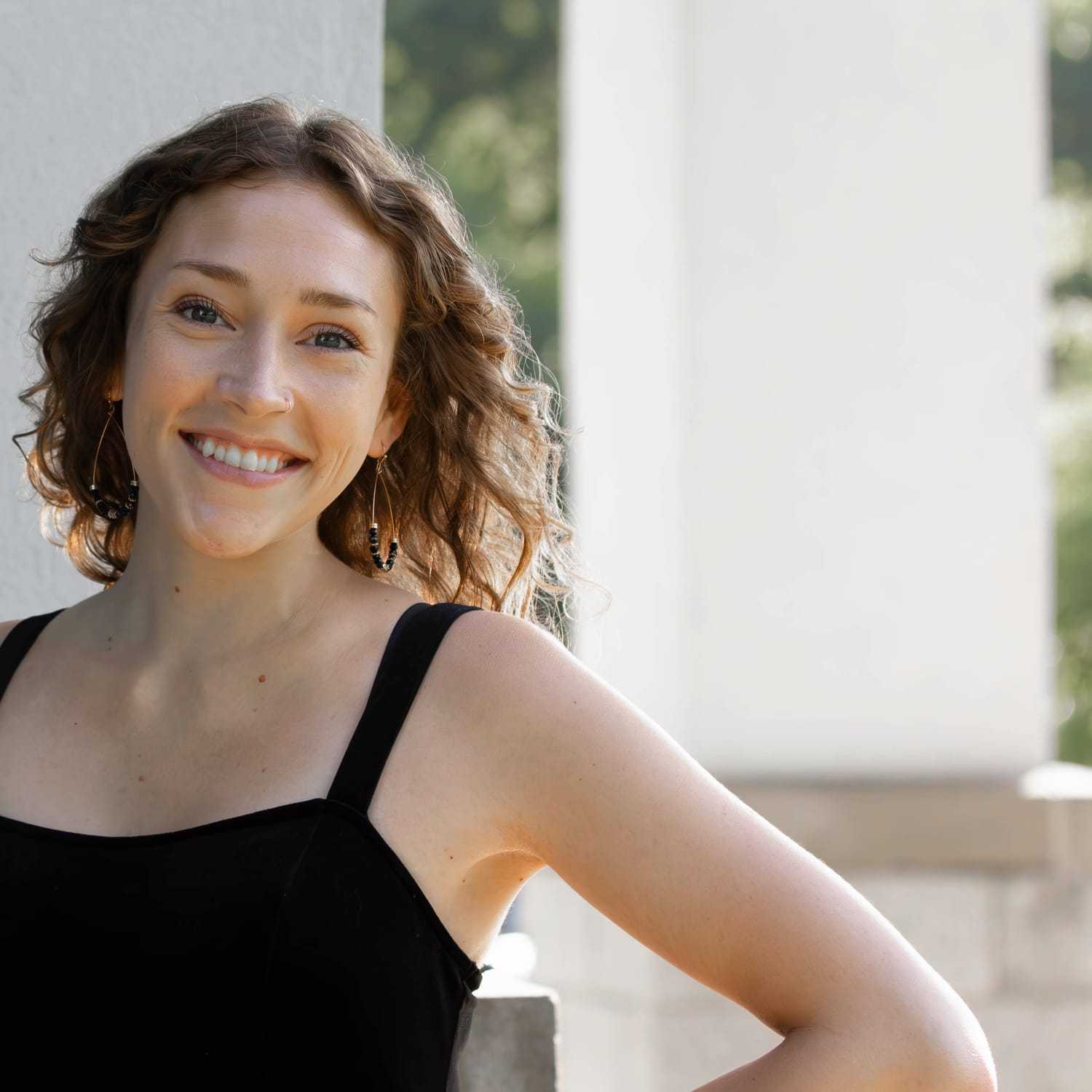 Portrait of Olivia J., a professional stylist at First Impressions Salon & Spa, showcasing their expertise and style.
