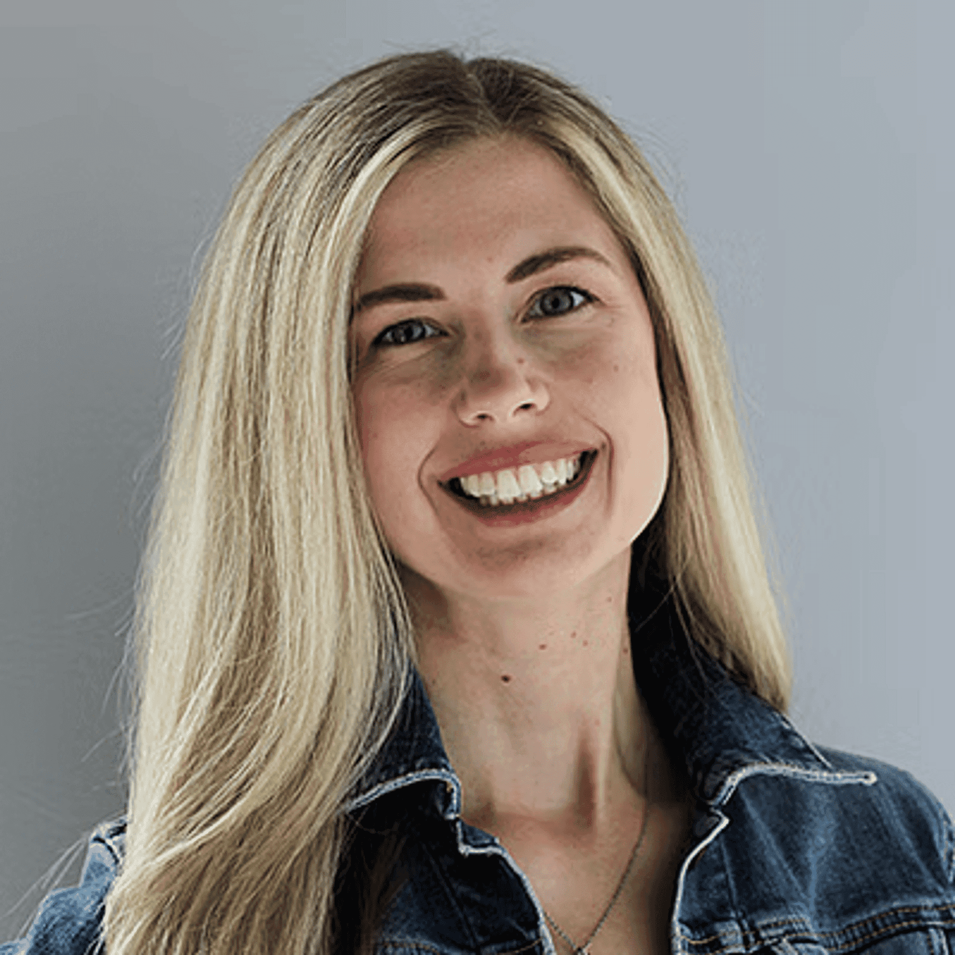 Portrait of Amanda G., a professional stylist at First Impressions Salon & Spa, showcasing their expertise and style.