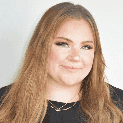 Portrait of Erin H., a professional stylist at First Impressions Salon & Spa, showcasing their expertise and style.