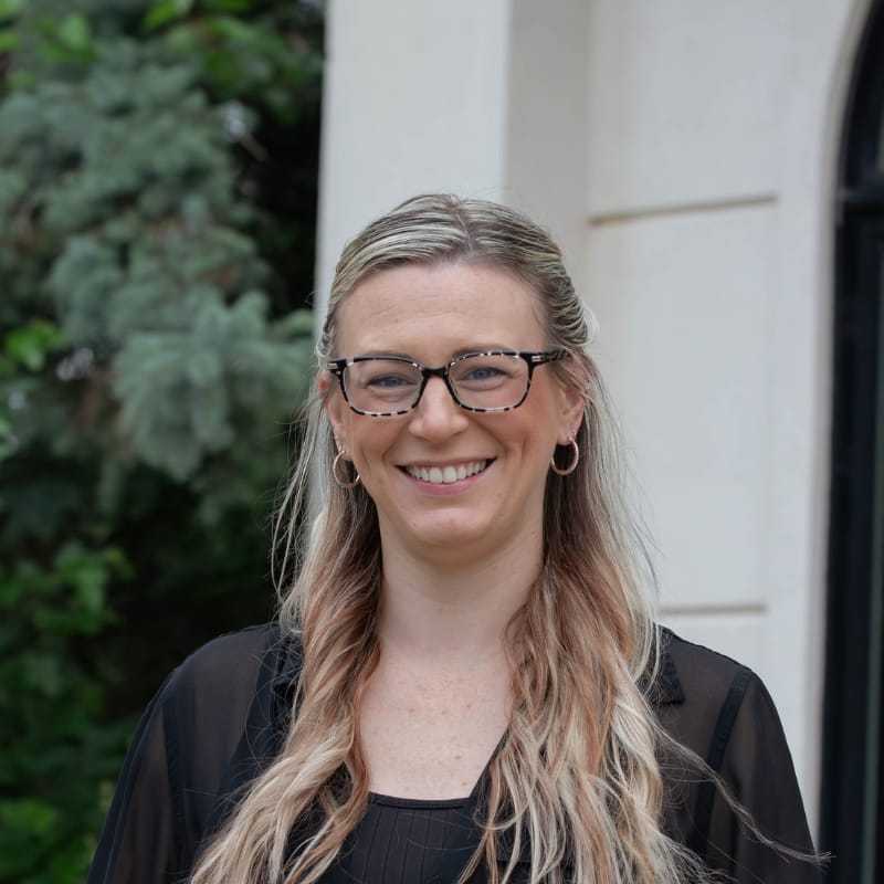 Portrait of Molly P., a professional stylist at First Impressions Salon & Spa, showcasing their expertise and style.