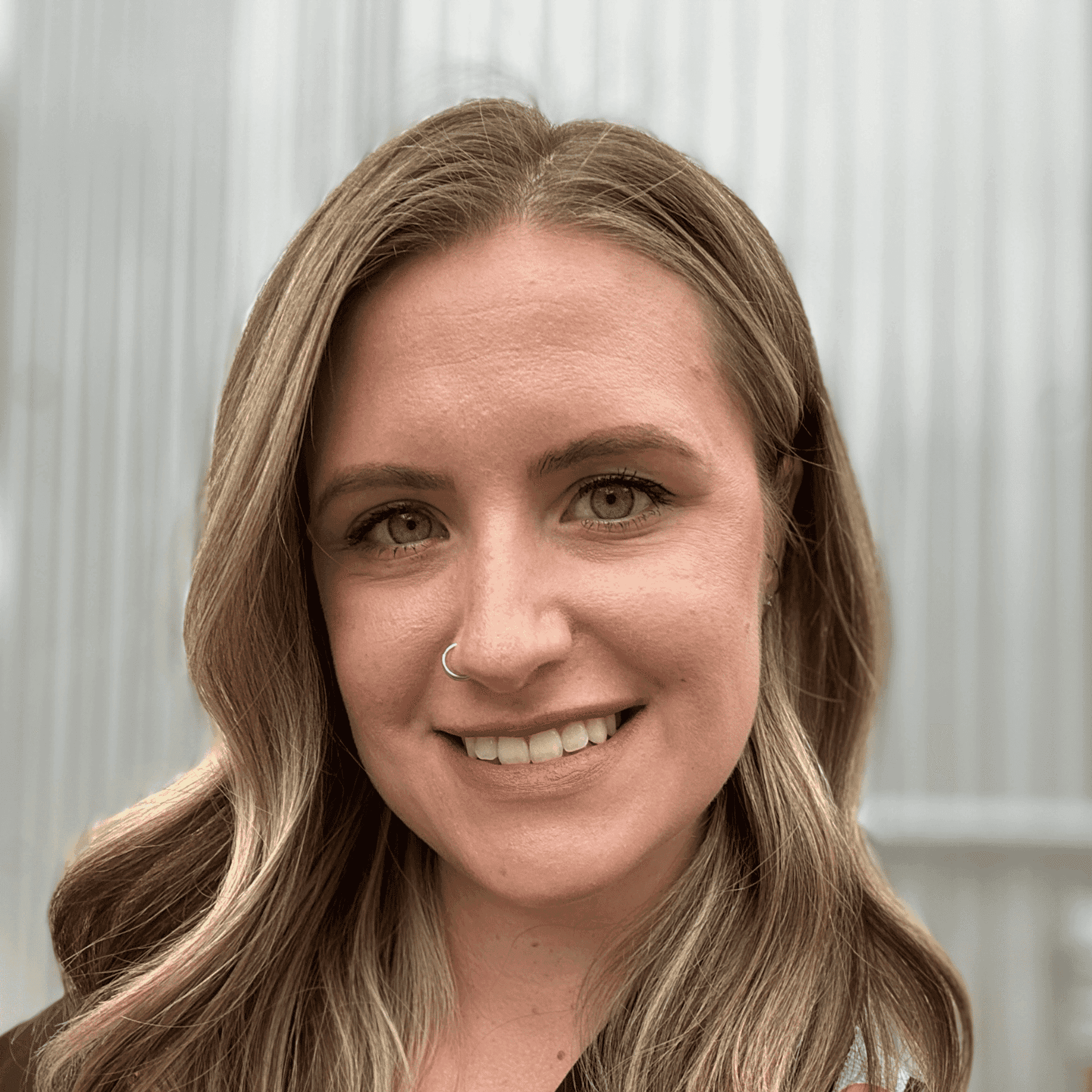 Portrait of Jessica, a professional stylist at First Impressions Salon & Spa, showcasing their expertise and style.