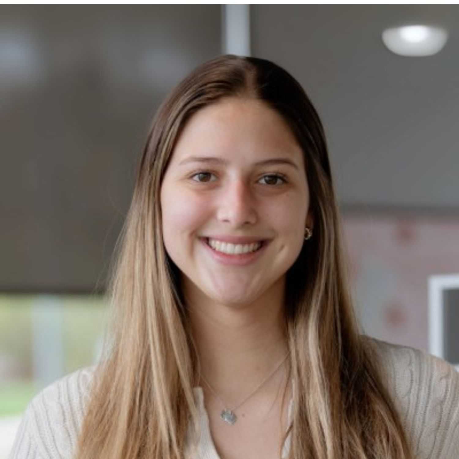 Portrait of Sophia D., a professional stylist at First Impressions Salon & Spa, showcasing their expertise and style.