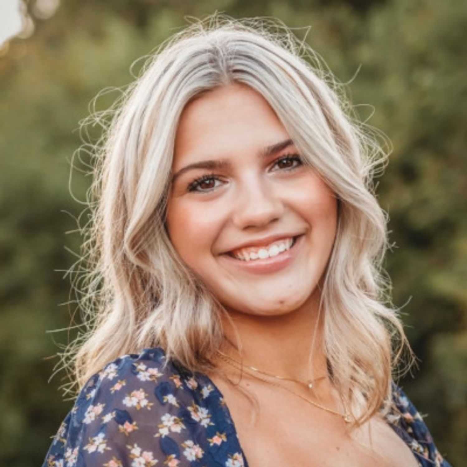 Portrait of Ashlyn B., a professional stylist at First Impressions Salon & Spa, showcasing their expertise and style.