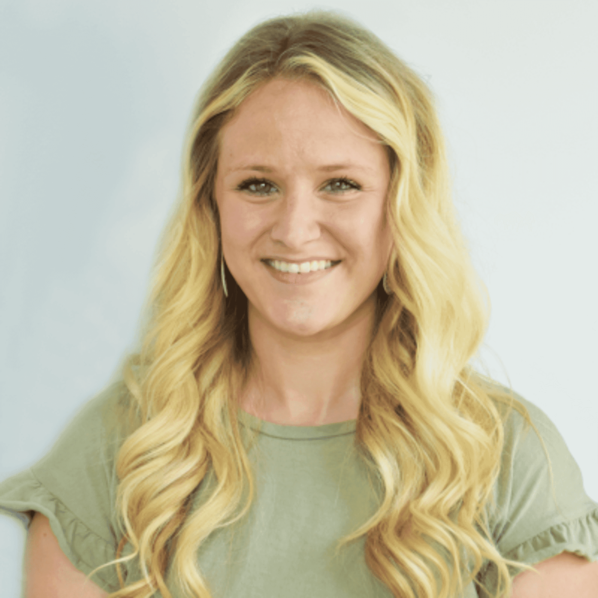 Portrait of Danielle A., a professional stylist at First Impressions Salon & Spa, showcasing their expertise and style.