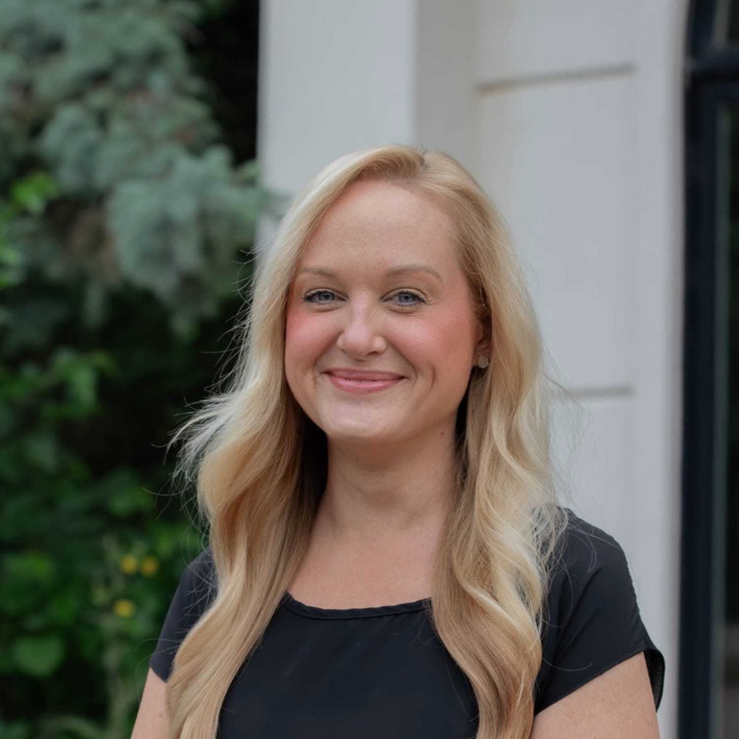 Portrait of Amber H., a professional stylist at First Impressions Salon & Spa, showcasing their expertise and style.