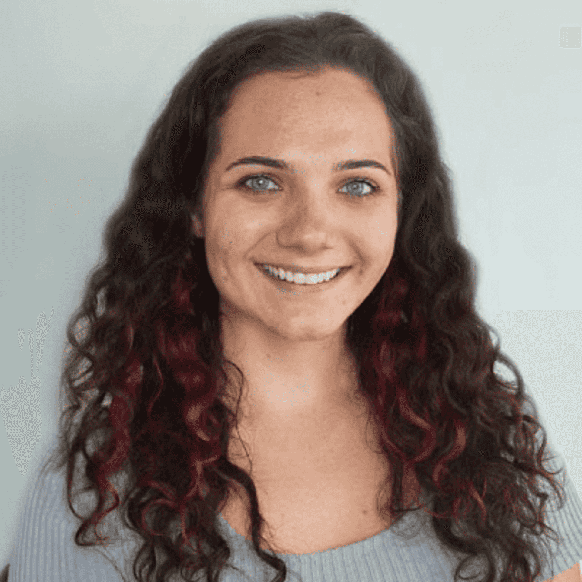 Portrait of Makayla C., a professional stylist at First Impressions Salon & Spa, showcasing their expertise and style.