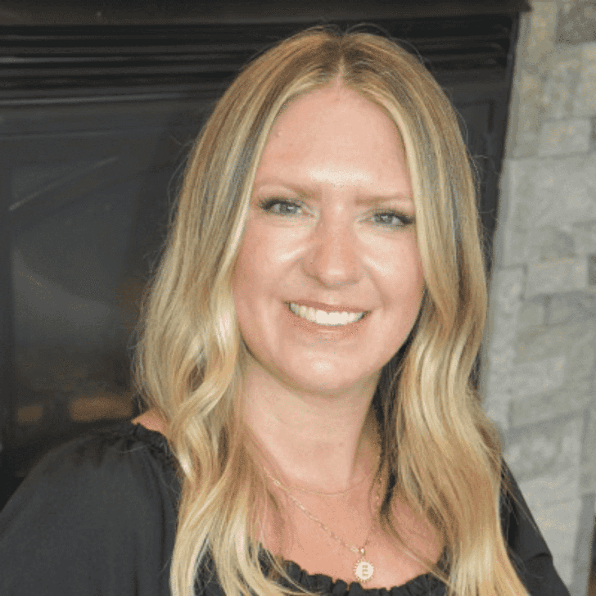 Portrait of Emilee S., a professional stylist at First Impressions Salon & Spa, showcasing their expertise and style.