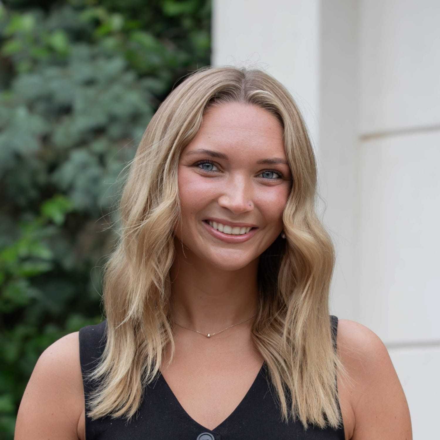 Portrait of Megan S., a professional stylist at First Impressions Salon & Spa, showcasing their expertise and style.